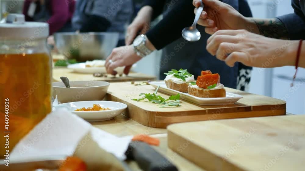 Cooking class, trainees learning in the kitchen. Cooking class, trainees learning in the kitchen.