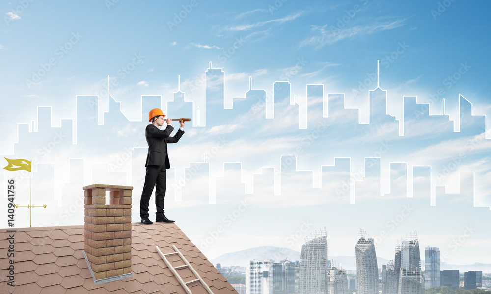 Engineer man standing on roof and looking in spyglass. Mixed media Engineer man standing on roof and looking in spyglass. Mixed media