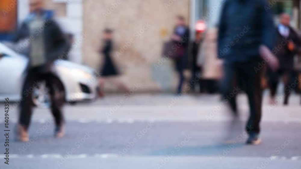 Time-lapse of Pedestrians crossing a road at night london england themes of routines on the move commuters rush hour Time-lapse of Pedestrians crossing a road at night london england themes of routines on the move commuters rush hour