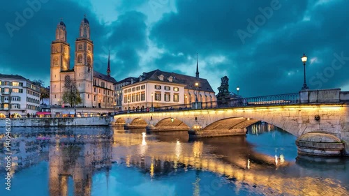 Munsterbrucke and Grossmunster church reflecting in river Limmat, Zurich, Switzerland (static image with animated sky)
