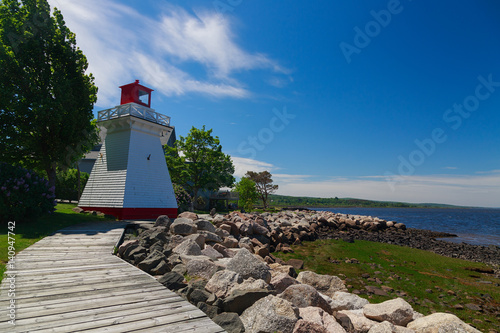 Lighthouse or range light overlooking the shoreline in Annapolis Royal, Nova Scotia, Canada.