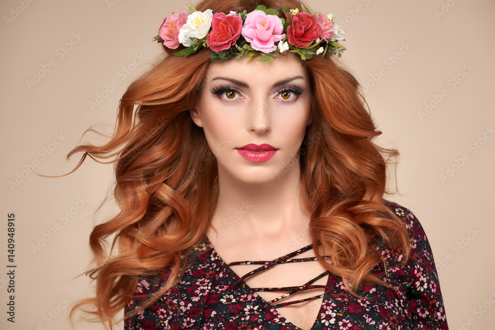 Beautiful Curly Redhead Portrait in Fashion Flower Wreath. Shiny Curly flower Volume Hairstyle. Happy Beauty Model Woman. Playful Glamour Confident Sexy lady, fashion Makeup, Boho wreath, Trendy Dress