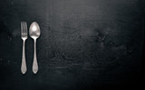 Cutlery. Fork and spoon. On Wooden background. Top view.