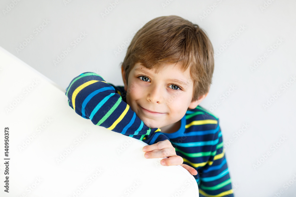 Portrait of little cute school kid boy in colorful clothes Portrait of little cute school kid boy in colorful clothes