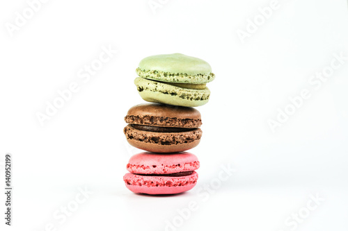 Three stocked macarons on whitre background photo