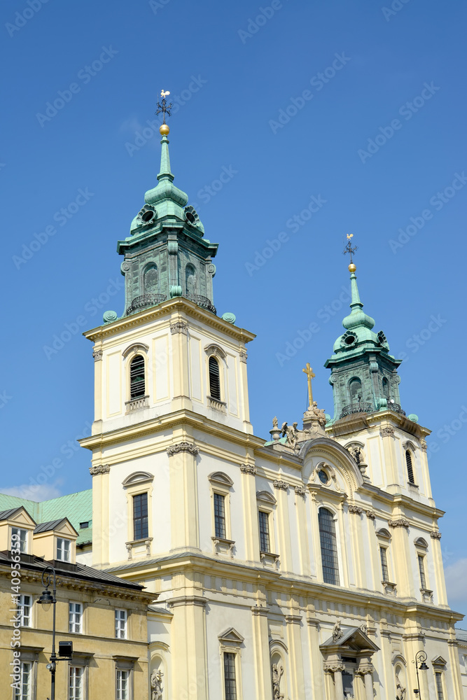  A cathedral church of the Sacred Cross against the background of the sky. Warsaw, Poland