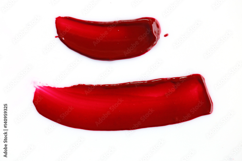 Texture of liquid red lipstick for lips isolated on white background. 