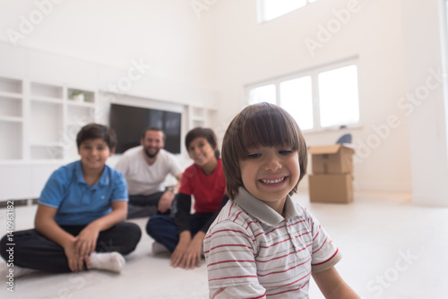 portrait of happy young boys with their dad