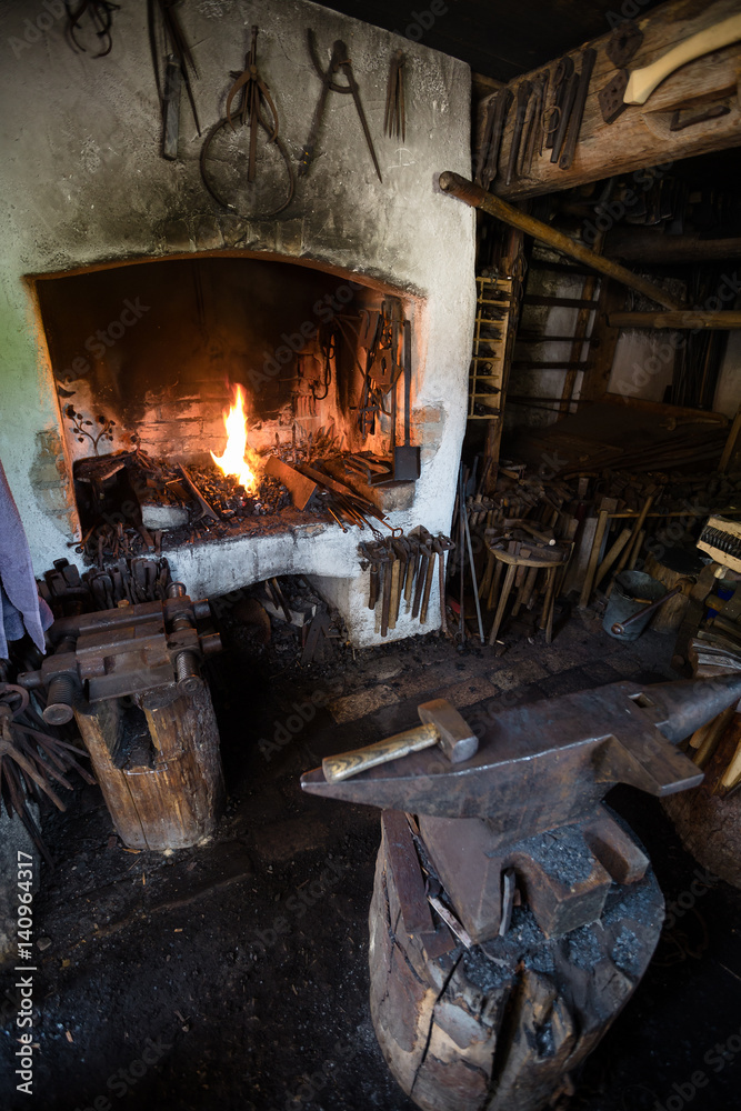 of old blacksmith's workshop. Working tools in smithy, nobody Stock-foto | Adobe