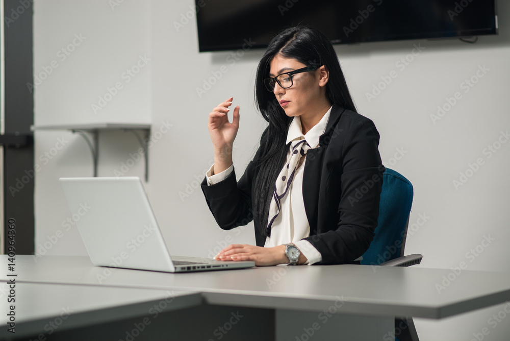 Young attractive & beautiful woman in an office Young attractive & beautiful woman in an office