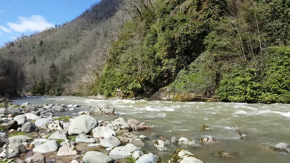 Mountain river with stones on shore Mountain river with stones on shore