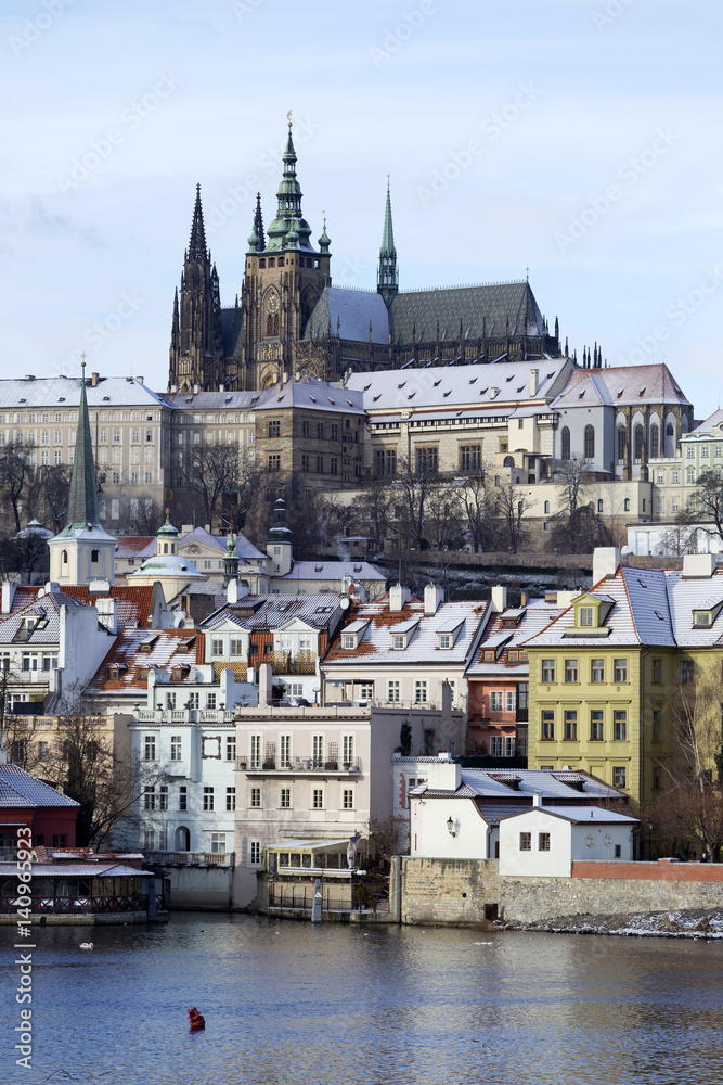 Obraz premium Snowy freeze Prague Lesser Town with gothic Castle, Czech republic