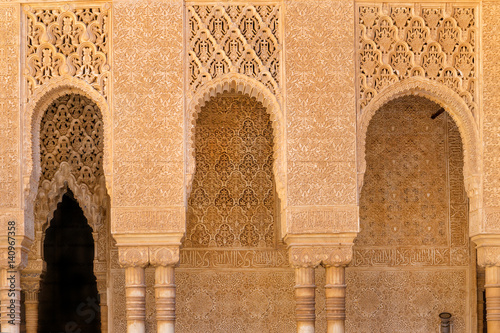 Moorish arches and columns of Alhambra harem in Granada, Spain