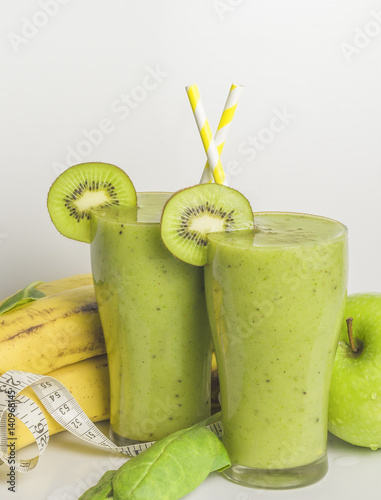 Fresh and healthy green smoothie with spinach,banana, kiwi and apple