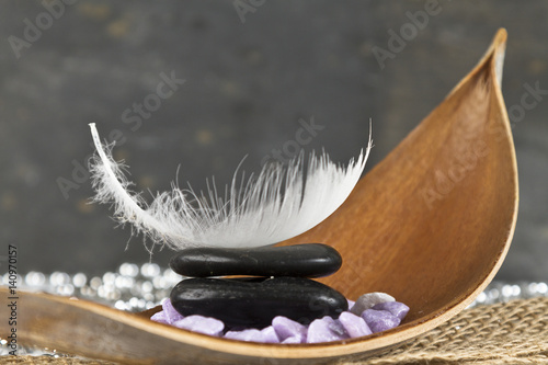 relaxation concept with feather and hot stones