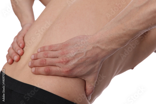 Muscular Man suffering from back pain isolated on white background. Incorrect sitting posture problems Muscle spasm, rheumatism. Pain relief, ,chiropractic concept. Sport exercising injury