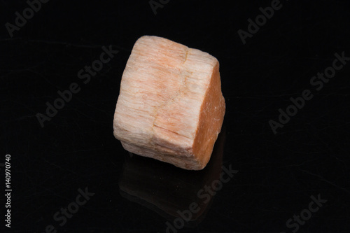 Rhodonite on black background from personal collection of Semi-precious stones and minerals photo