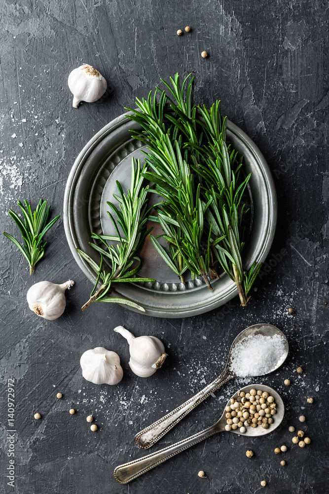 Rosemary, garlic, salt and white pepper, culinary background with