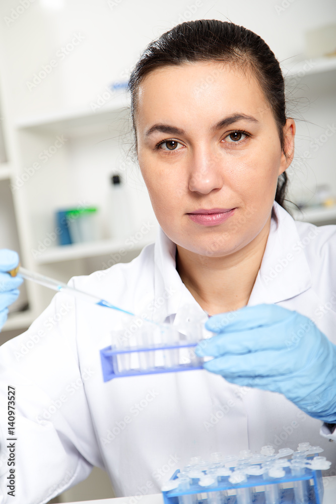 laboratory assistant analyzing a liquid laboratory assistant analyzing a liquid