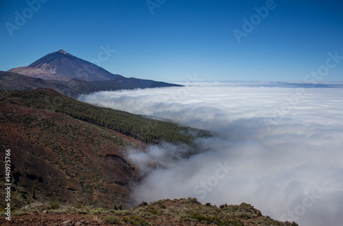 mountain peak above clouds landscape