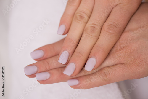 woman fingers with french manicure