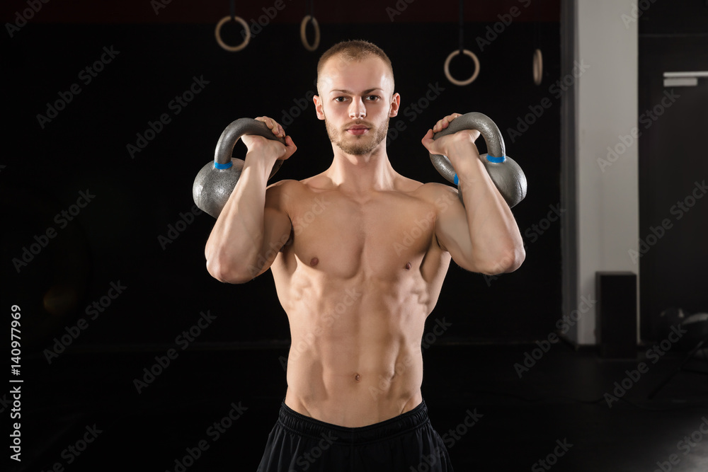 Man Exercising With Kettle Bell Man Exercising With Kettle Bell