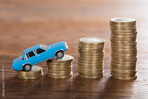 Car Model On Stacked Coin