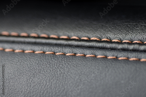 Car leather background. Interior macro photo.