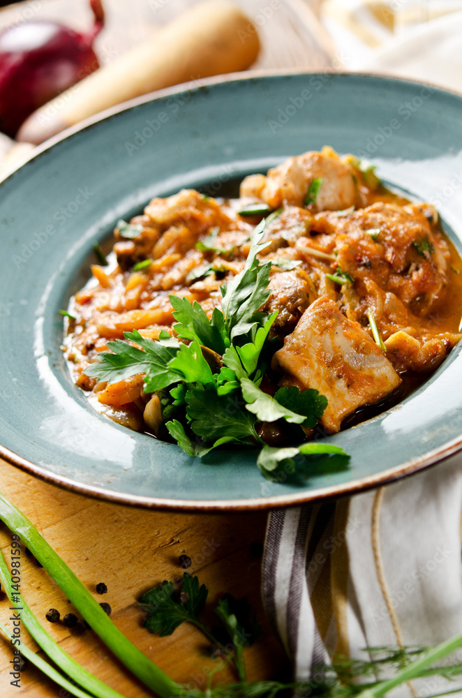 Chakhokhbili. Stewed poultry meat in tomato sauce with spices and garlic Chakhokhbili. Stewed poultry meat in tomato sauce with spices and garlic