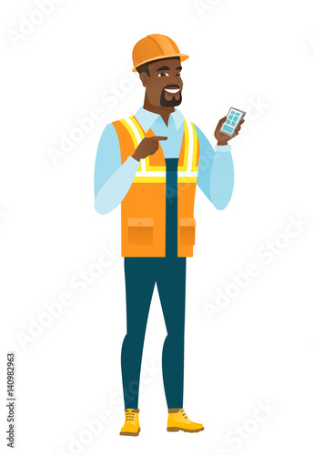 African-american builder holding a mobile phone.