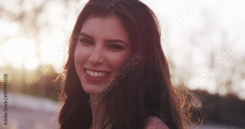 Smiling model spins around, slow motion