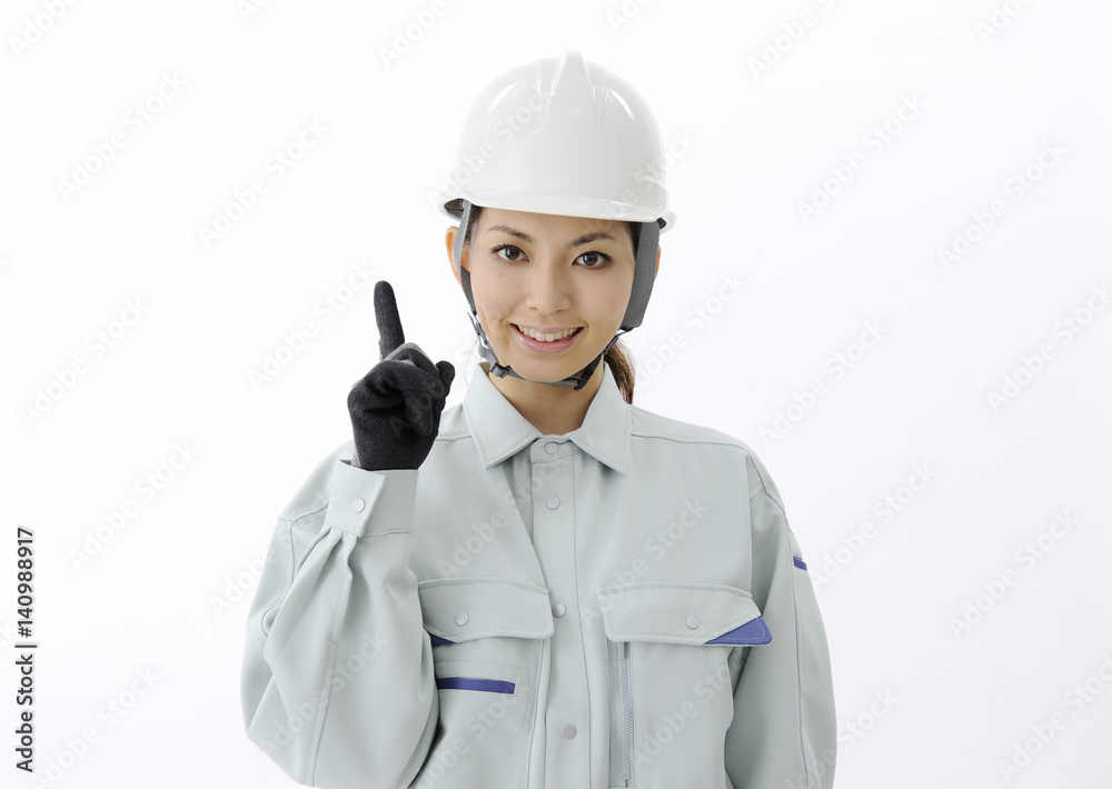 Construction worker pointing with her finger Construction worker pointing with her finger
