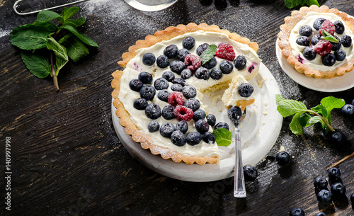 Cheese cake with fresh berries and whipped cream
