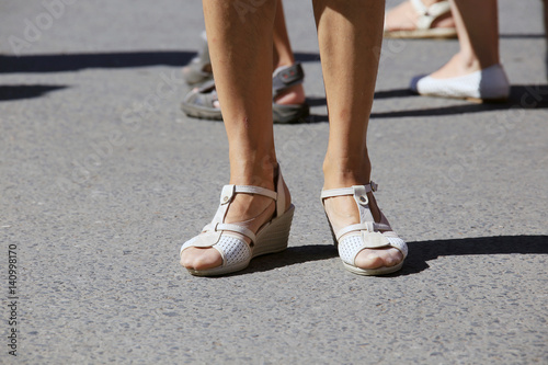 female legs in sandals