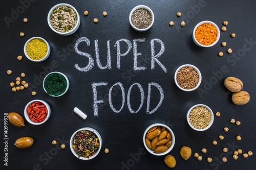 Superfood and healthy food on blackboard. Organic food.