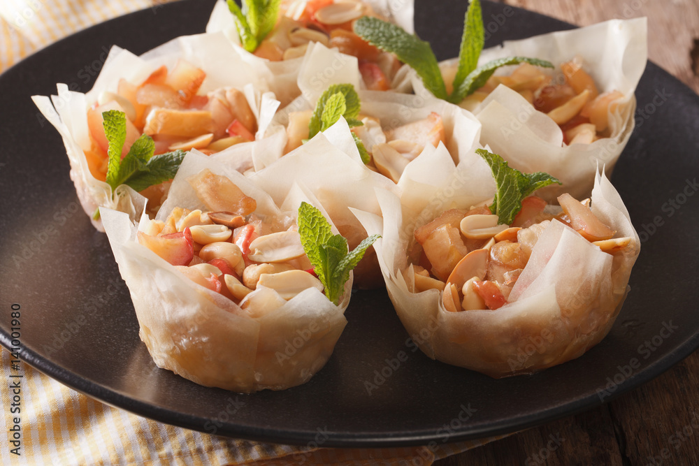 Filo pastry stuffed with apples and peanuts closeup. horizontal Filo pastry stuffed with apples and peanuts closeup. horizontal