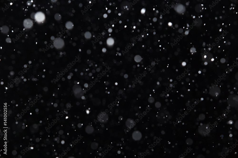 snow on a black background snow on a black background