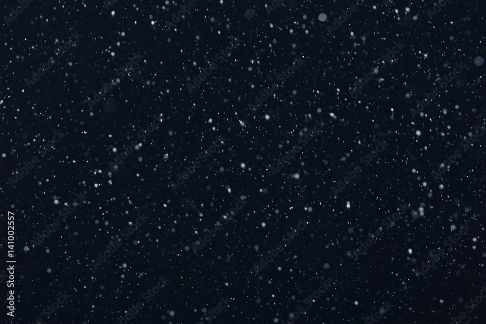 snow on a black background