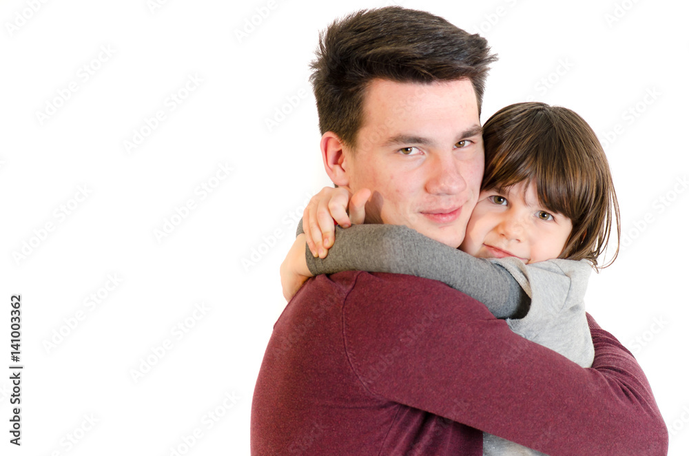 Brother and little sister hugging love each other isolated on white Brother and little sister hugging love each other isolated on white
