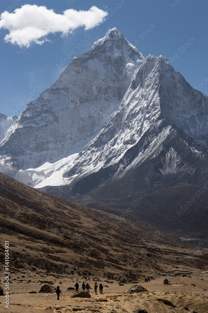 Ama Dablam mountain peak and trekkers, Everest region