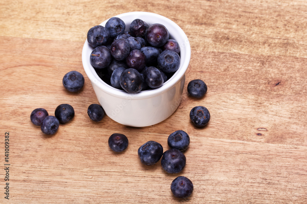Pot of blueberries on a rustic background Pot of blueberries on a rustic background