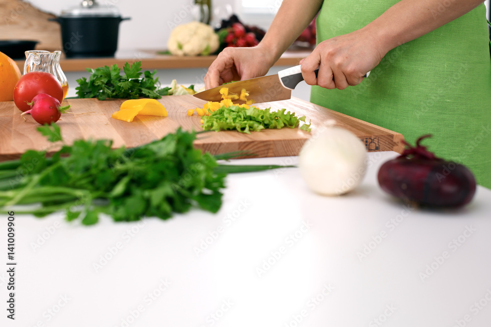 Close up of woman's hands cooking in the kitchen. Housewife slicing white bread. Vegetarian and healthily cooking concept Close up of woman's hands cooking in the kitchen. Housewife slicing white bread. Vegetarian and healthily cooking concept