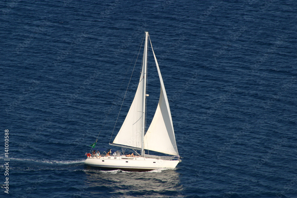 Fototapeta premium sailing yacht on dark blue sea