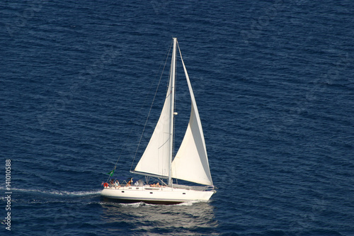 sailing yacht on dark blue sea
