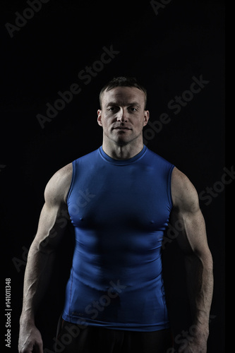  bodybuilder handsome man with muscular body training in gym
