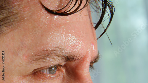 Face of very sweating man photo