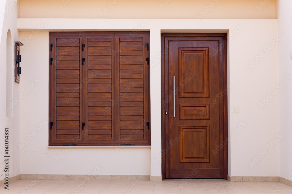 brown doors and windows with shutters brown doors and windows with shutters