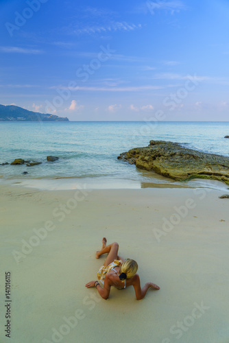Fototapeta Naklejka Na Ścianę i Meble -  Woman on the beach in Surin Phuket