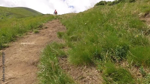 Human walking up mountain Goverla. Ukraine photo