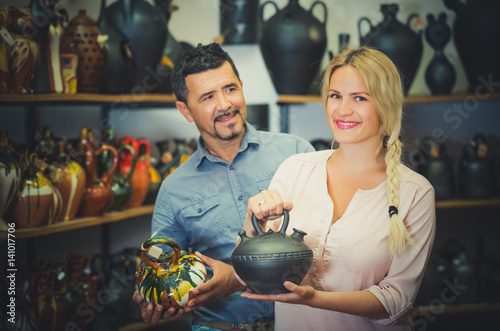 Man and woman selecting pot